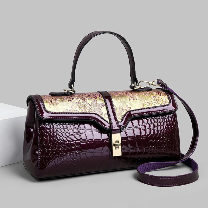 Nouveaux arrivages : Sac à main de luxe pour femmes en cuir verni avec détails floraux.