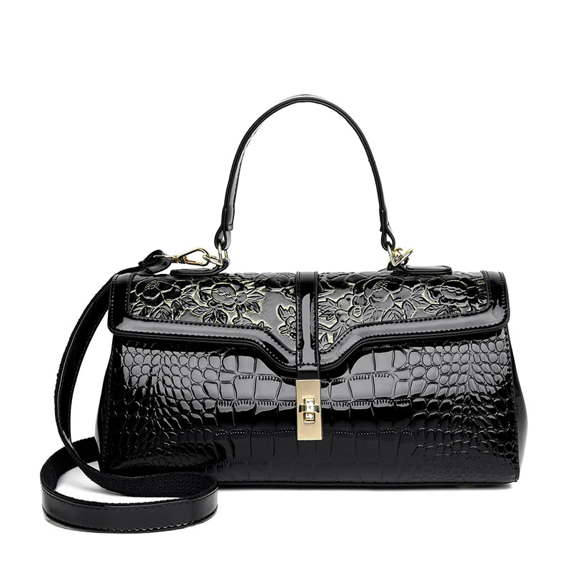 Nouveaux arrivages : Sac à main de luxe pour femmes en cuir verni avec détails floraux.