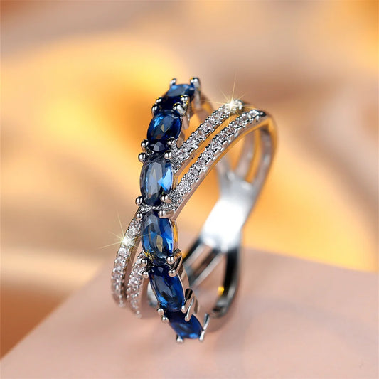 Bagues croisées en pierre ovale en cristal bleu pour femmes, bijoux de fiançailles, couleur argent, tendance, cadeaux d'anniversaire simples à la mode