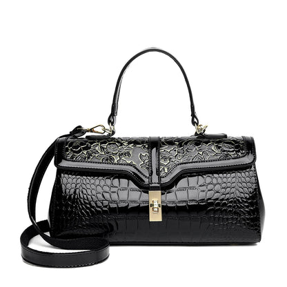 Nouveaux arrivages : Sac à main de luxe pour femmes en cuir verni avec détails floraux.